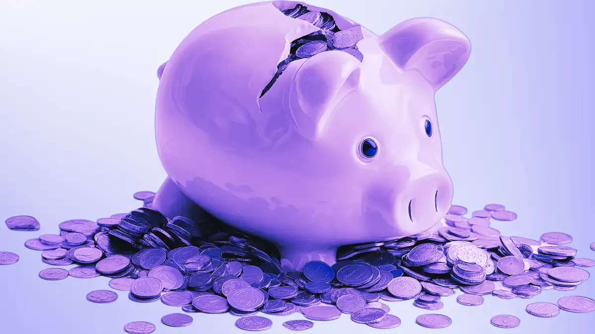 Cracked piggy bank leaking coins, representing lower interest rates in Capital One 360 savings accounts compared to newer accounts