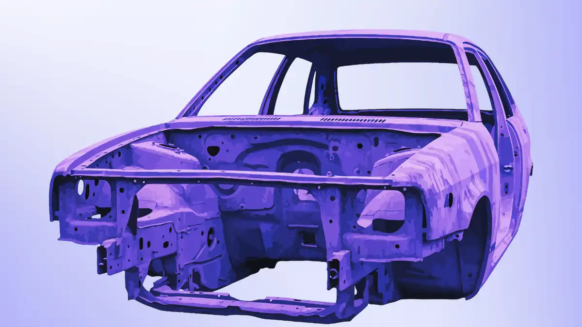 Stripped car frame showing underlying structure, representing system-level analysis and hidden architecture behind surface appearance of virtual influencers